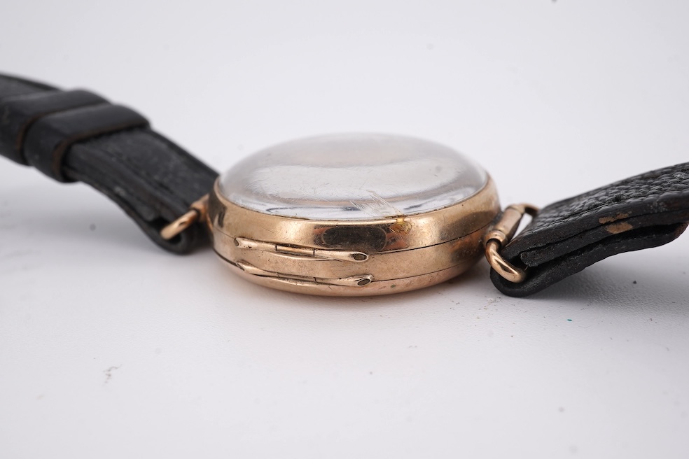An early 20th century 9ct gold Zenith manual wind wrist watch, retailed by Favre Leuba, with Roman dial and subsidiary seconds, case diameter 28mm, on an associated leather strap. Condition - poor to fair